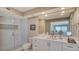 Updated bathroom with walk-in shower and white cabinetry at 2295 Gulf Of Mexico Dr # 115S, Longboat Key, FL 34228