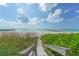 Wooden walkway to secluded beach; peaceful ocean views at 2295 Gulf Of Mexico Dr # 115S, Longboat Key, FL 34228