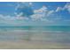 Expansive sandy beach with ocean waves at 2295 Gulf Of Mexico Dr # 115S, Longboat Key, FL 34228