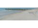 Tranquil beach scene with a jetty at 2295 Gulf Of Mexico Dr # 115S, Longboat Key, FL 34228