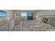 Bedroom with water views and access to balcony at 2295 Gulf Of Mexico Dr # 115S, Longboat Key, FL 34228