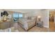 Main bedroom with water views and sitting area at 2295 Gulf Of Mexico Dr # 115S, Longboat Key, FL 34228