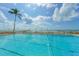 Inviting pool area with oceanfront access at 2295 Gulf Of Mexico Dr # 115S, Longboat Key, FL 34228