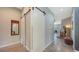 Hallway features modern design with sliding barn doors, concrete floors, and ample natural light at 2434 Wood St, Sarasota, FL 34237