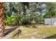 Private backyard with lush landscaping and trees at 2503 Bispham Rd, Sarasota, FL 34231