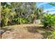 Landscaped backyard with mature trees and privacy at 2503 Bispham Rd, Sarasota, FL 34231