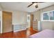 Spacious bedroom with hardwood floors, dresser, and ceiling fan at 2503 Bispham Rd, Sarasota, FL 34231