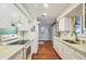 Modern kitchen featuring white cabinets, quartz countertops, and stainless steel appliances at 2503 Bispham Rd, Sarasota, FL 34231