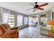 Relaxing sunroom with tiled floors, ample natural light, and access to the backyard at 2503 Bispham Rd, Sarasota, FL 34231