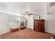 Simple bedroom with large window and wood armoire at 2519 17Th W Ave, Bradenton, FL 34205