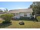 House exterior showcasing a stone accent and landscaping at 2519 17Th W Ave, Bradenton, FL 34205