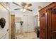 Hallway with ornate armoire and tiled floors at 2519 17Th W Ave, Bradenton, FL 34205