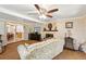 Living room with fireplace, comfy seating and view to dining area at 2519 17Th W Ave, Bradenton, FL 34205