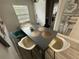 Modern dining area with gray table and mid-century modern chairs at 2606 19Th St, Sarasota, FL 34234