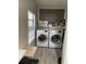 Bright laundry room with washer, dryer, and ample storage at 2606 19Th St, Sarasota, FL 34234