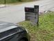 Modern mailbox with rustic wood post at 2606 19Th St, Sarasota, FL 34234