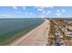 Aerial view of beach with shoreline and homes at 2762 W Vina Del Mar Blvd, St Pete Beach, FL 33706