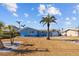 Ranch style home with light blue exterior and palm trees at 2762 W Vina Del Mar Blvd, St Pete Beach, FL 33706