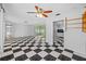 Living room with a checkerboard floor and sliding doors at 2762 W Vina Del Mar Blvd, St Pete Beach, FL 33706