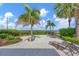 Spacious backyard with lounge chairs and a beautiful ocean view at 325 Casey Key Rd, Nokomis, FL 34275