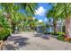 Private driveway surrounded by lush tropical landscaping at 325 Casey Key Rd, Nokomis, FL 34275