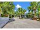 Landscaped driveway leading to a private and tranquil home at 325 Casey Key Rd, Nokomis, FL 34275