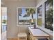 Kitchen nook with ocean view and built-in wooden desk at 325 Casey Key Rd, Nokomis, FL 34275