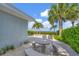 Charming patio with a stone table and benches, perfect for outdoor dining at 325 Casey Key Rd, Nokomis, FL 34275