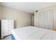 Bright bedroom with a queen bed and ample closet space at 3275 Beneva Rd # 104, Sarasota, FL 34232