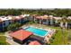 Community pool with surrounding patio and lounge chairs at 3275 Beneva Rd # 104, Sarasota, FL 34232