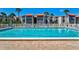 Refreshing community pool with lounge chairs at 3275 Beneva Rd # 104, Sarasota, FL 34232