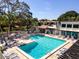 Community pool and patio area at 3275 Beneva Rd # 104, Sarasota, FL 34232