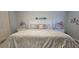 Main bedroom with a queen bed and decorative pillows at 3401 Rochelle Ct # 131, Clearwater, FL 33761