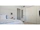 Bedroom with a queen bed, large closet and soft blue walls at 3401 Rochelle Ct # 131, Clearwater, FL 33761