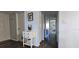 Bright hallway with dark hardwood floors and access to other rooms at 3401 Rochelle Ct # 131, Clearwater, FL 33761