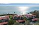 Aerial view of waterfront condos with red tile roofs and lush landscaping at 3460 Wild Oak Bay Blvd # 145, Bradenton, FL 34210