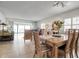 Bright dining room with wood table and chairs, near living room at 3460 Wild Oak Bay Blvd # 145, Bradenton, FL 34210