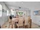 Dining room with light wood table and woven chairs at 3460 Wild Oak Bay Blvd # 145, Bradenton, FL 34210