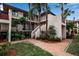 Condo building showcasing walkways, landscaping, and brick pavers at 3460 Wild Oak Bay Blvd # 145, Bradenton, FL 34210