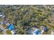 A spacious lot with mature trees, outlined in white, offering privacy and potential for building at 3864 Gocio Rd, Sarasota, FL 34235