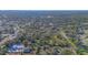 Expansive land, defined by a white line, surrounded by dense trees and established homes at 3864 Gocio Rd, Sarasota, FL 34235