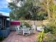 Private patio features seating area and lush greenery at 4019 Worcester Rd, Sarasota, FL 34231