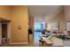 Kitchen with breakfast bar, view into living room at 4122 Central Sarasota Pkwy # 1925, Sarasota, FL 34238