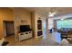 Living room with fireplace and built-in shelving at 4122 Central Sarasota Pkwy # 1925, Sarasota, FL 34238