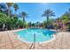 Inviting community swimming pool with surrounding lounge chairs at 4122 Central Sarasota Pkwy # 1925, Sarasota, FL 34238