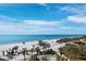 Stunning beach view featuring white sand, palm trees, and clear blue water at 415 L Ambiance Dr # C404, Longboat Key, FL 34228