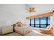 Bright bedroom with a large window offering ocean views, complemented by stylish furniture at 415 L Ambiance Dr # C404, Longboat Key, FL 34228