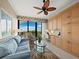 Cozy living room features a view of the ocean, comfortable seating and built-in storage at 415 L Ambiance Dr # C404, Longboat Key, FL 34228