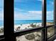 Stunning ocean view from the condo windows showcasing a white sand beach and clear blue water at 415 L Ambiance Dr # C404, Longboat Key, FL 34228