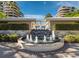 Beautiful water feature between buildings with manicured hedges, landscaping and paver walkway at 415 L Ambiance Dr # C404, Longboat Key, FL 34228